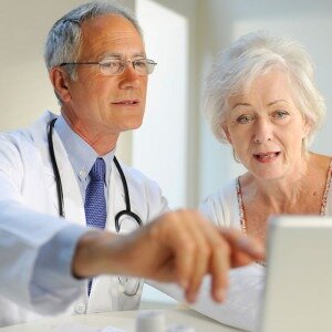 Doctor talking to Retiree